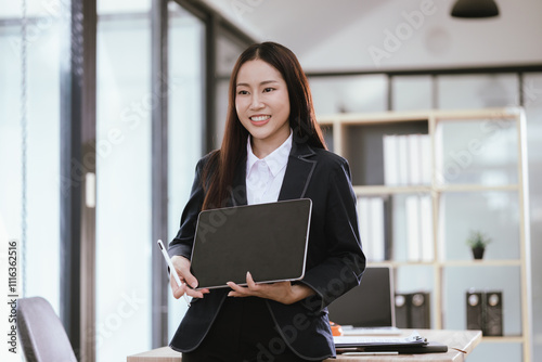 Beautiful Asian businesswoman in modern office