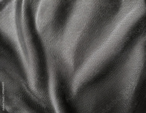 Dark colored fabric folds as background texture