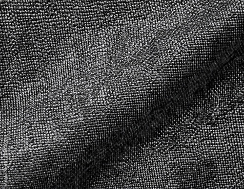 Dark colored fabric folds as background texture