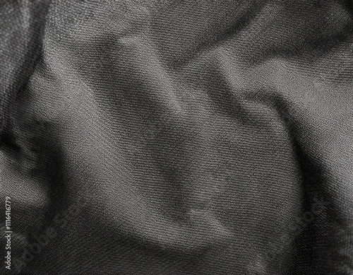 Dark colored fabric folds as background texture