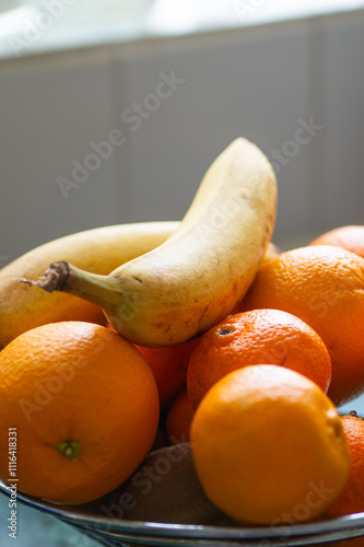 Oranges  and bananas in a basket. Fruits.