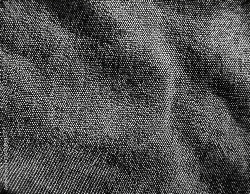 Dark colored fabric folds as background texture
