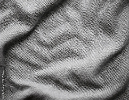 Dark colored fabric folds as background texture