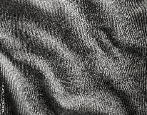 Dark colored fabric folds as background texture