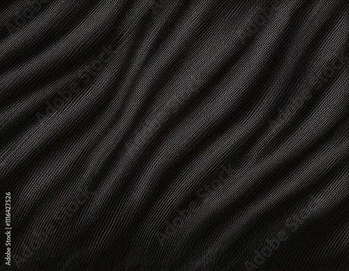 Dark colored fabric folds as background texture
