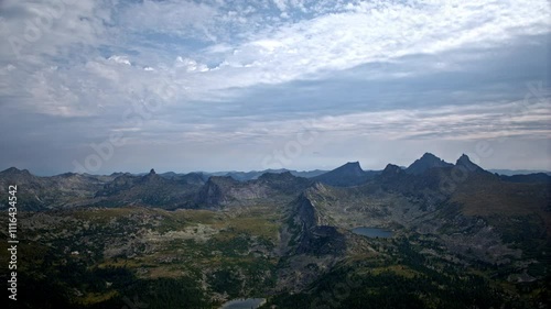 Clouds moving over mountain lake timelapse