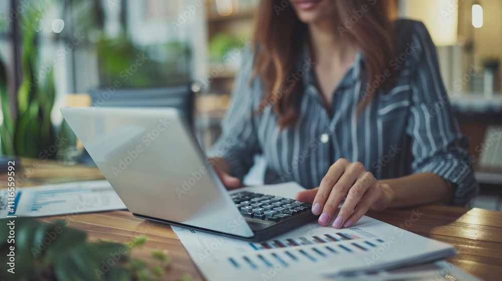 Business financing and accounting, businesswoman calculating finances at home office desk, using calculator for finance accounting Business financing and accounting, businesswoman calculating finances at home office desk, using calculator for finance accounting