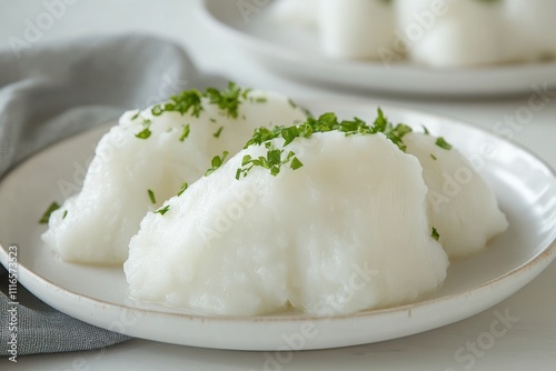 Delicious White Ceramic Plate Garnished with Fresh Parsley and Soft Potatoes in Natural Lighting, Perfect for Rustic Scandinavian Dining Aesthetic photo