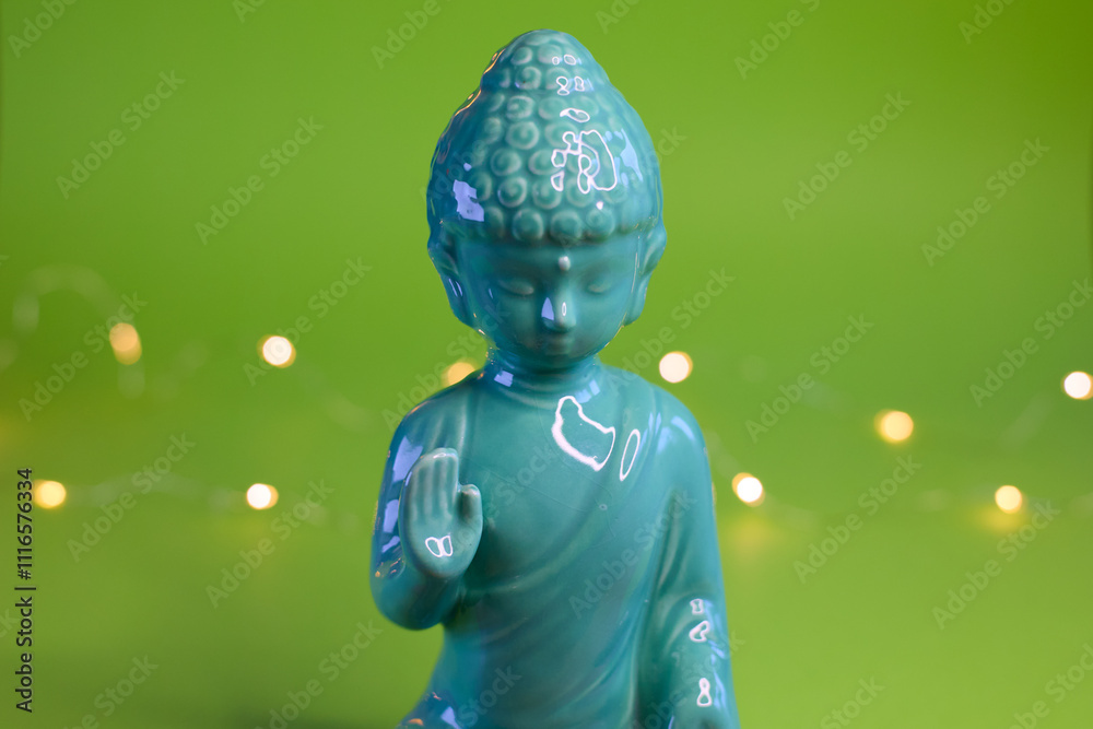 A Serene, Beautiful Buddha Statue on a Vibrant Green Background with Soft, Gentle Lights