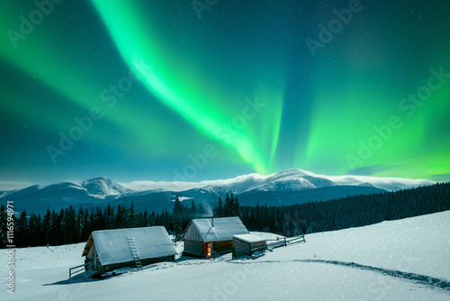 A winter scene with a solitary wooden cabins in snowy mountains under incredible night sky with Northern lights. Aurora borealis. Christmas holiday and winter vacations concept