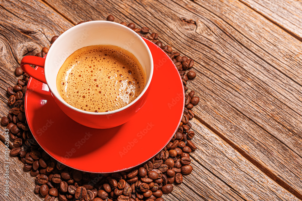 A cup of aromatic coffee on a wooden table.