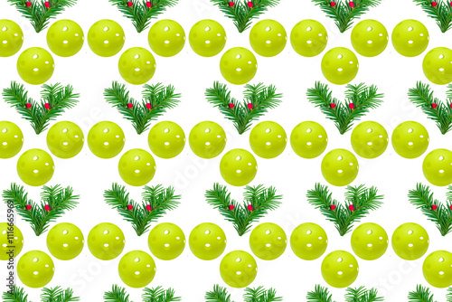 Pattern of green yew branches with red berries and green pickleballs on a whi...