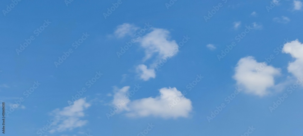 A lonely cloud in the sky. A summer sunny day, a small white fluffy cloud hangs in the blue sky. The cloud resembles the letter Z of the English alphabet. The image was made from several white strokes A lonely cloud in the sky. A summer sunny day, a small white fluffy cloud hangs in the blue sky. The cloud resembles the letter Z of the English alphabet. The image was made from several white strokes
