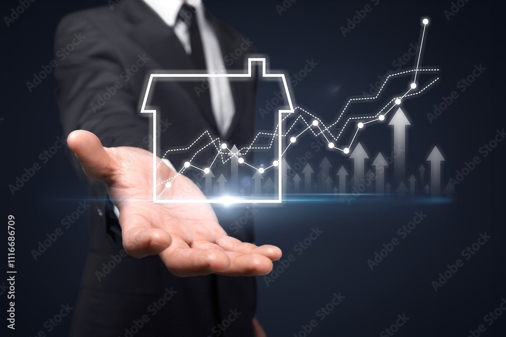 © BillionPhotos.com - Businessman hand holding virtual graph real estate growth. © BillionPhotos.com - Businessman hand holding virtual graph real estate growth.