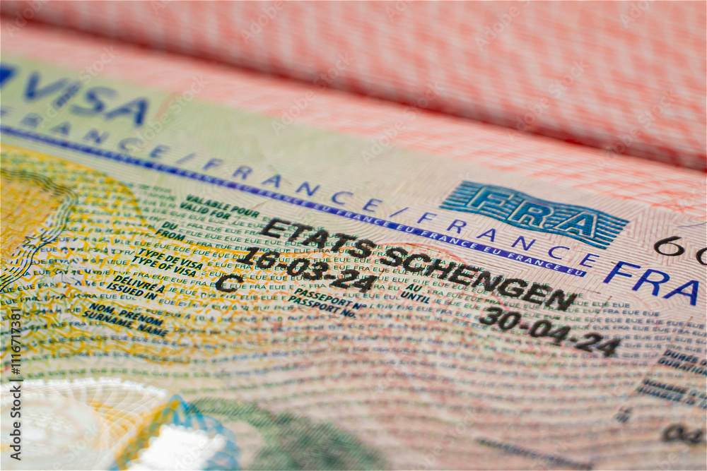 Fototapeta premium France Schengen visa in passport for visit Europe. closeup