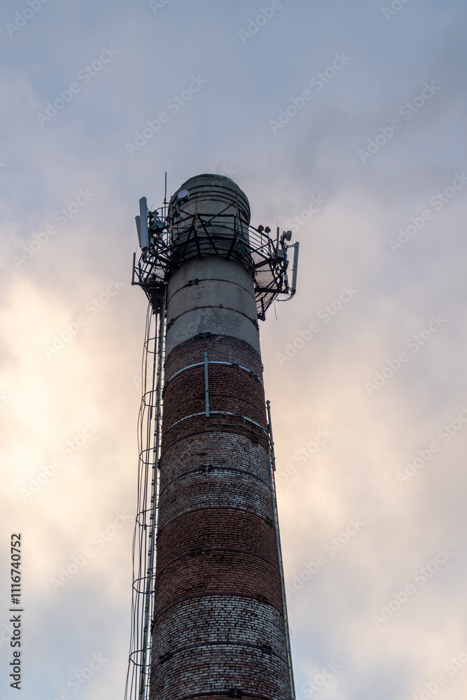 Industrial pipe. Chimney on the sky background Industrial pipe. Chimney on the sky background