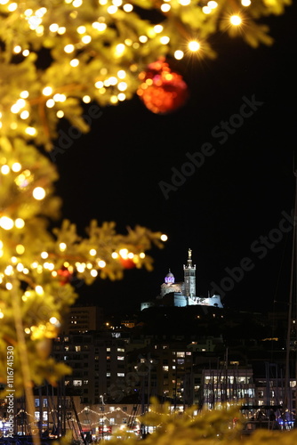 The Notre Dame de la Garde basilica seen from the old port of Marseille in December at the Christmas market