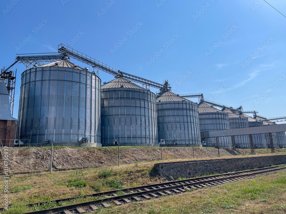 Silos at the factory. Transportation of grain by rail. Storage of grain in silos Silos at the factory. Transportation of grain by rail. Storage of grain in silos