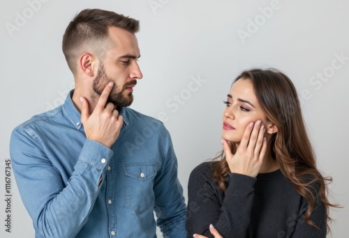 synchronized thoughtful moment captured as partners mirror each other with contemplative hand gestures their faces showing matching expressions of deep reflection photo