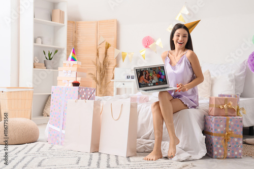 Happy young woman with lapt...