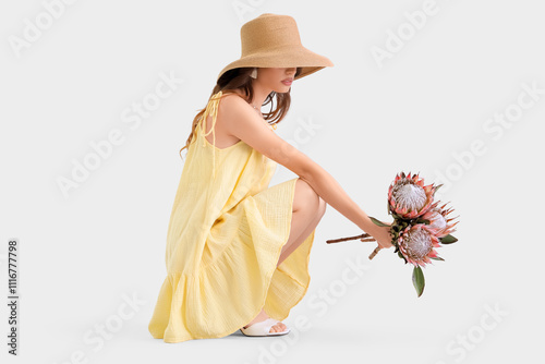 Young woman in hat with pro...