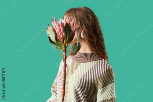 Young woman with protea flo...