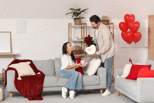 Loving couple exchanging gi...