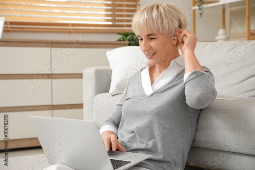 Mature woman with hearing a...