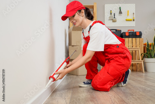 Female worker applying seal...
