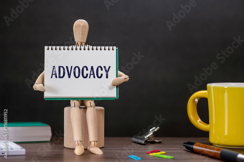 There is notebook with the word Advocacy. It is as an eye-catching image. photo