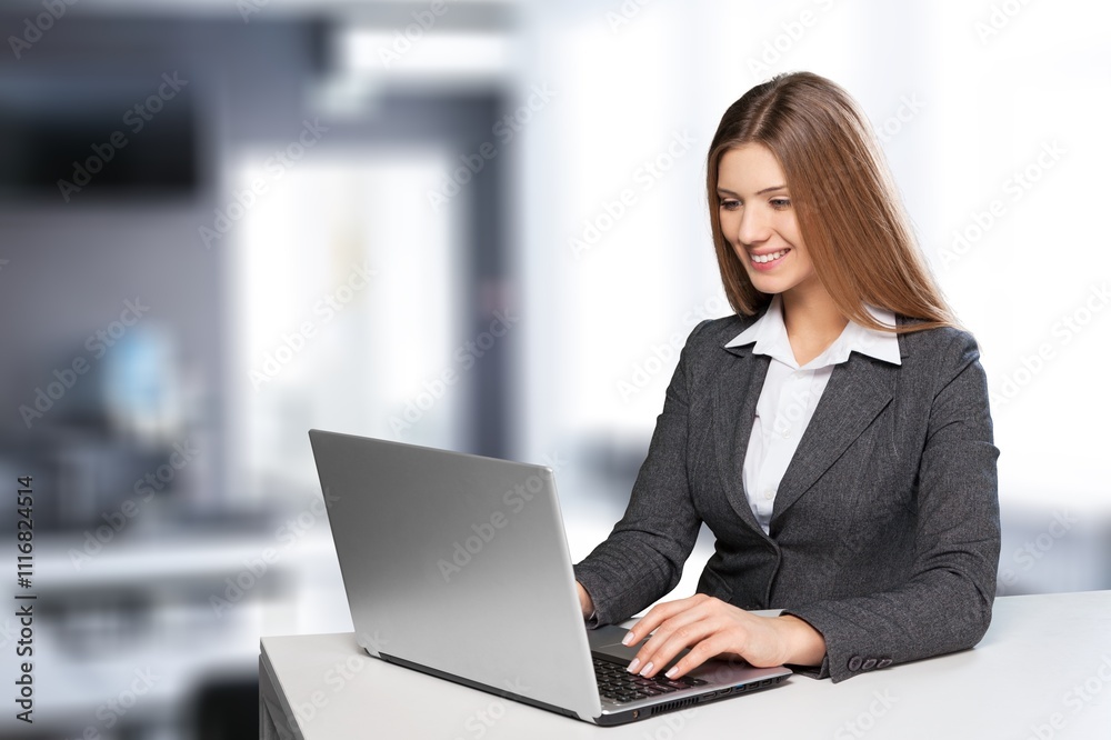 Focused young business woman work on laptop computer Focused young business woman work on laptop computer