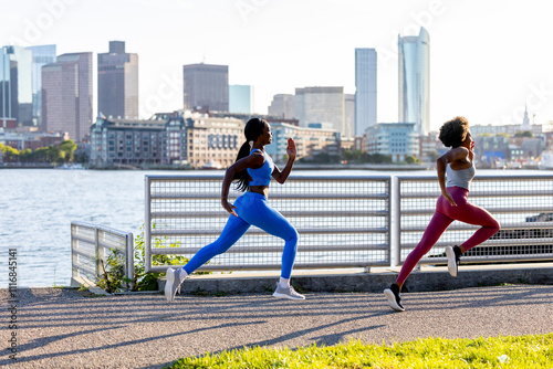Two healthy determination black athletes running in Boston