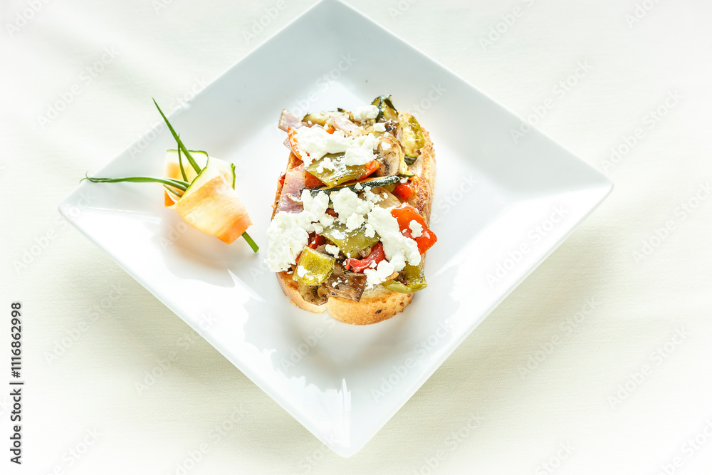 A plate of food with a cucumber and a piece of bread A plate of food with a cucumber and a piece of bread