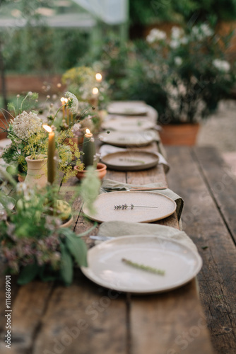 Wooden dining table set with a floral-themed table spread photo