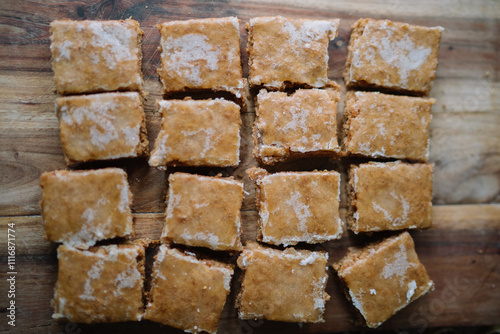 Neatly arranged brown squares with white glaze. photo