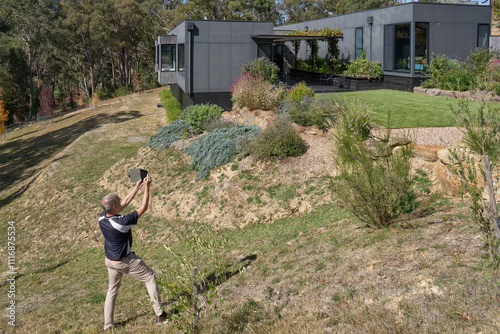 Building Inspector checking exterior on modern residential home