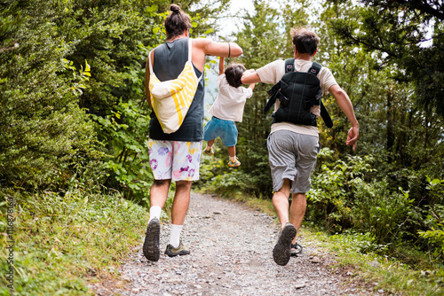 Parents and toddler having fun during nature trek
