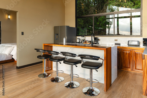 
Interior of an equipped kitchen of a cabin with a view of landscapes