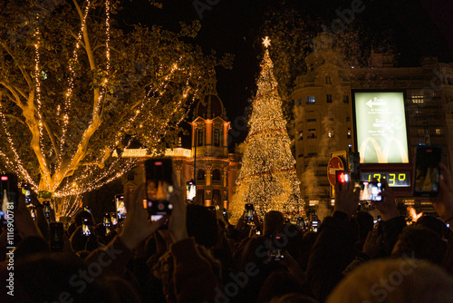 Christmas Lights Switch-On in December at Night with Crowd of People Filming with Their Mobile Phones. Valencia, Spain