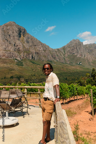 African man in front of vineyard