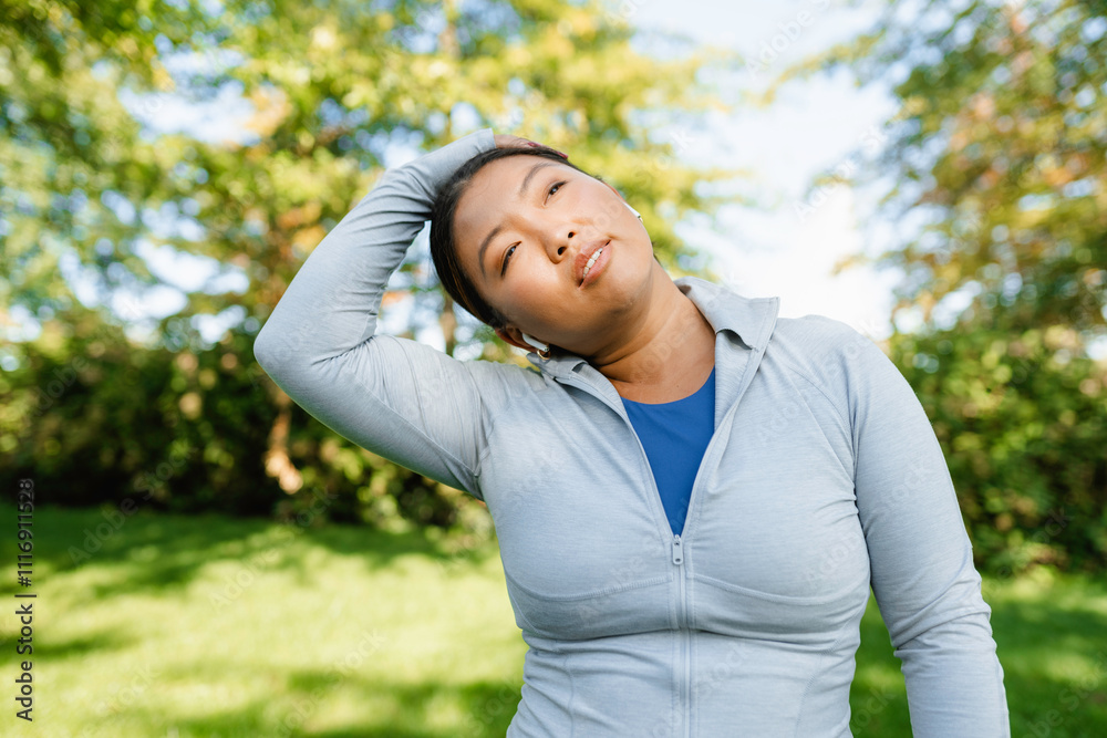 A woman does exercises in the park A woman does exercises in the park