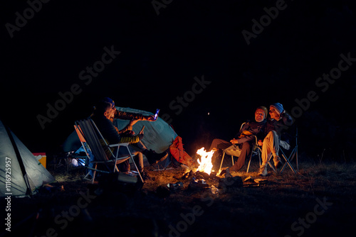 Group of people enjoys an overnight stay at a campsite