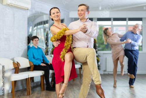 Adult couple dancing and practicing in dance class