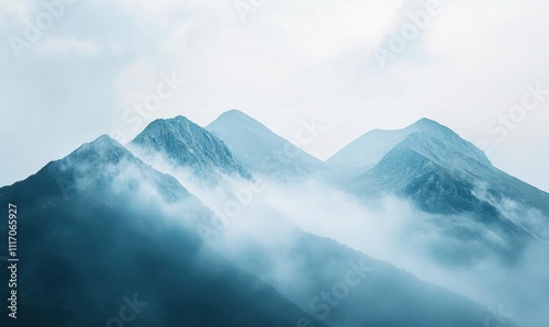 Wallpaper Mural Misty mountains shrouded in clouds create a serene landscape. Torontodigital.ca