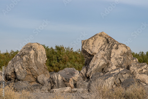 Obsidian Butte on the south shore of the Salton Sea. Calipatria, Imperial County, California. The Salton Buttes lie within the Salton Sea Geothermal Field. Rhyolite. dry lake bed. photo