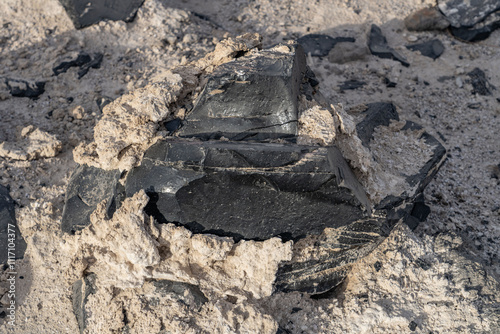 Obsidian Butte on the south shore of the Salton Sea. Calipatria, Imperial County, California. The Salton Buttes lie within the Salton Sea Geothermal Field. Rhyolite. dry lake bed. photo