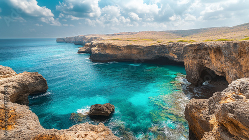 Breathtaking seascape with turquoise water and rocky cliffs under cloudy sky