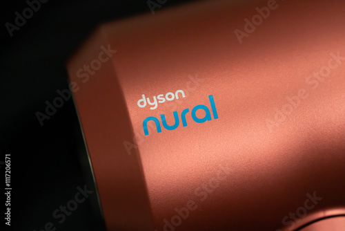 BANGKOK - THAILAND December 01 2024 : Closed up of trademark DYSON NURAL printed the new Dyson supersonic nural hair dryer strawberry pink bronze color