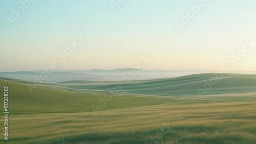 Wallpaper Mural Serene landscape featuring rolling green hills under a soft morning sky. Torontodigital.ca