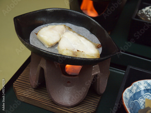 Heating Gindara Black cod steak on personal frying pan for japanese breakfast  photo